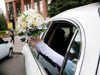 Bride in Lincoln Limousine